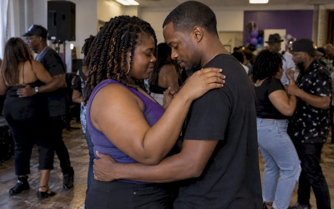 Couple slow dancing at an R&B party
