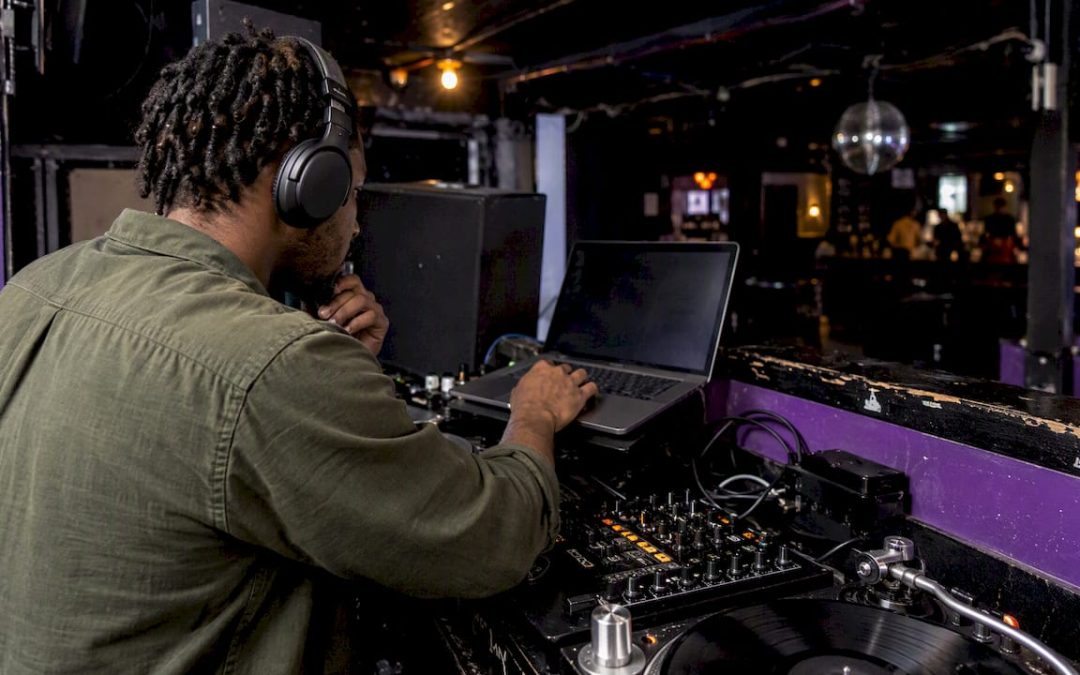 DJ listening to a submitted rap track